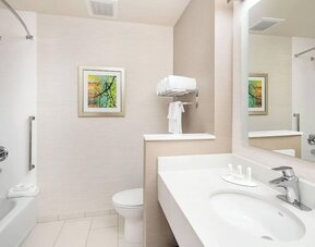 Guest bathroom with shower at Fairfield Inn & Suites By Marriott North Bergen.