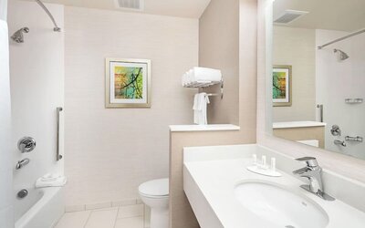Guest bathroom with shower at Fairfield Inn & Suites By Marriott North Bergen.