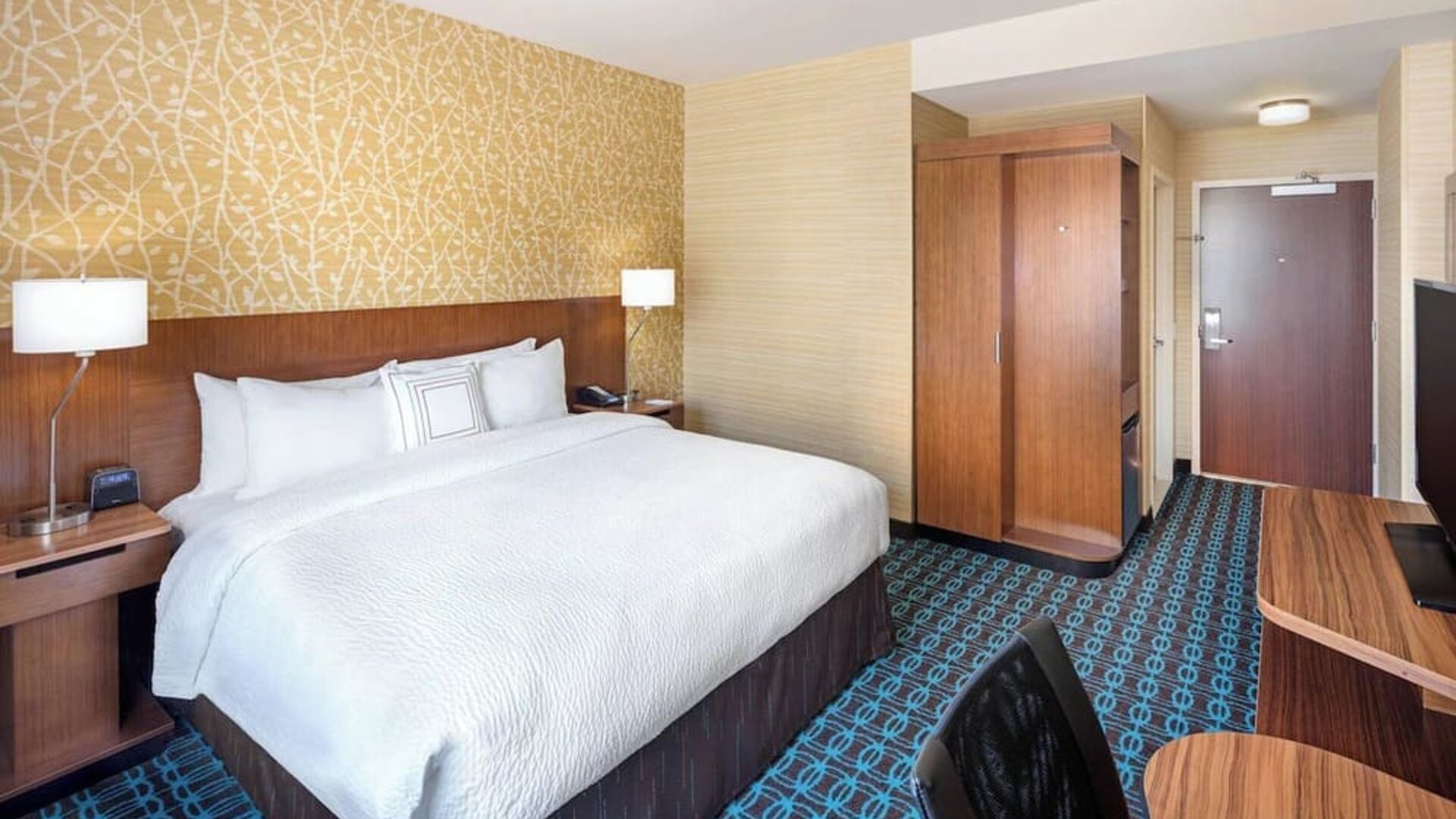 King room with work desk and TV at Fairfield Inn & Suites By Marriott North Bergen.