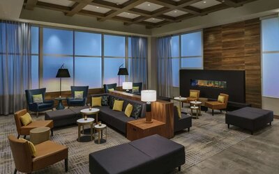Lobby lounge with fireplace and workspace at Hilton Garden Inn Sunnyvale.