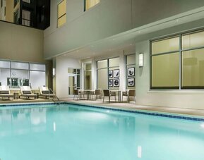 Outdoor pool with lounge chairs at Hilton Garden Inn Sunnyvale.
