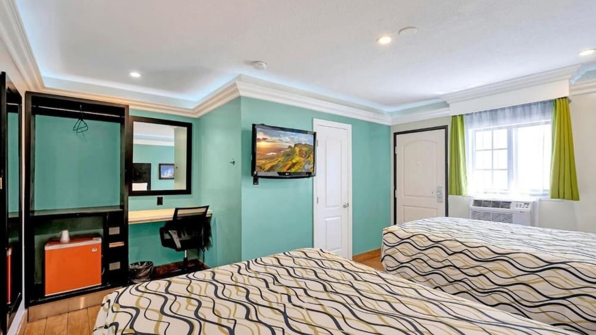 Queen room with mini-fridge at Mid City Inn - Los Angeles.