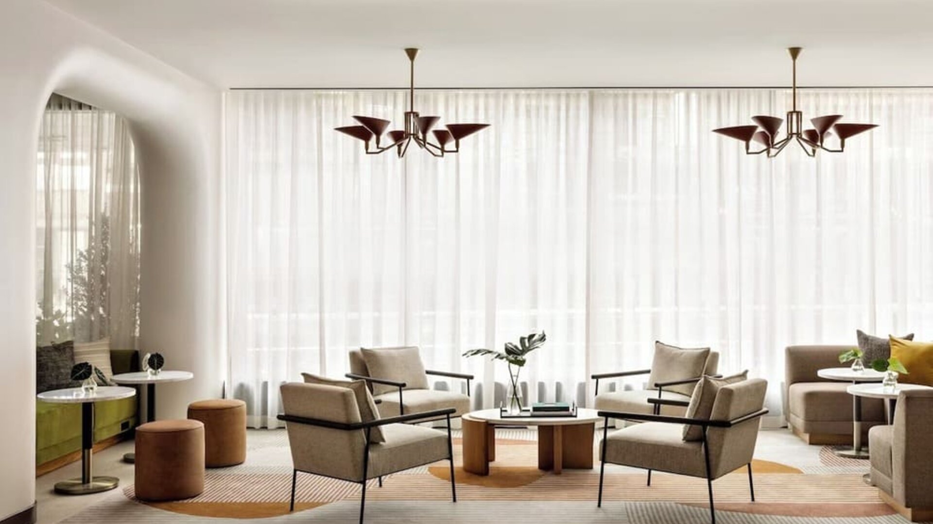 Lobby lounge and workspace at Kimpton Theta New York - Times Square.