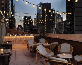 Terrace lounge area at Kimpton Theta New York - Times Square.