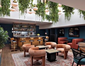 On-site bar with lounge seating at Kimpton Theta New York - Times Square.