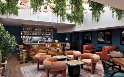 On-site bar with lounge seating at Kimpton Theta New York - Times Square.