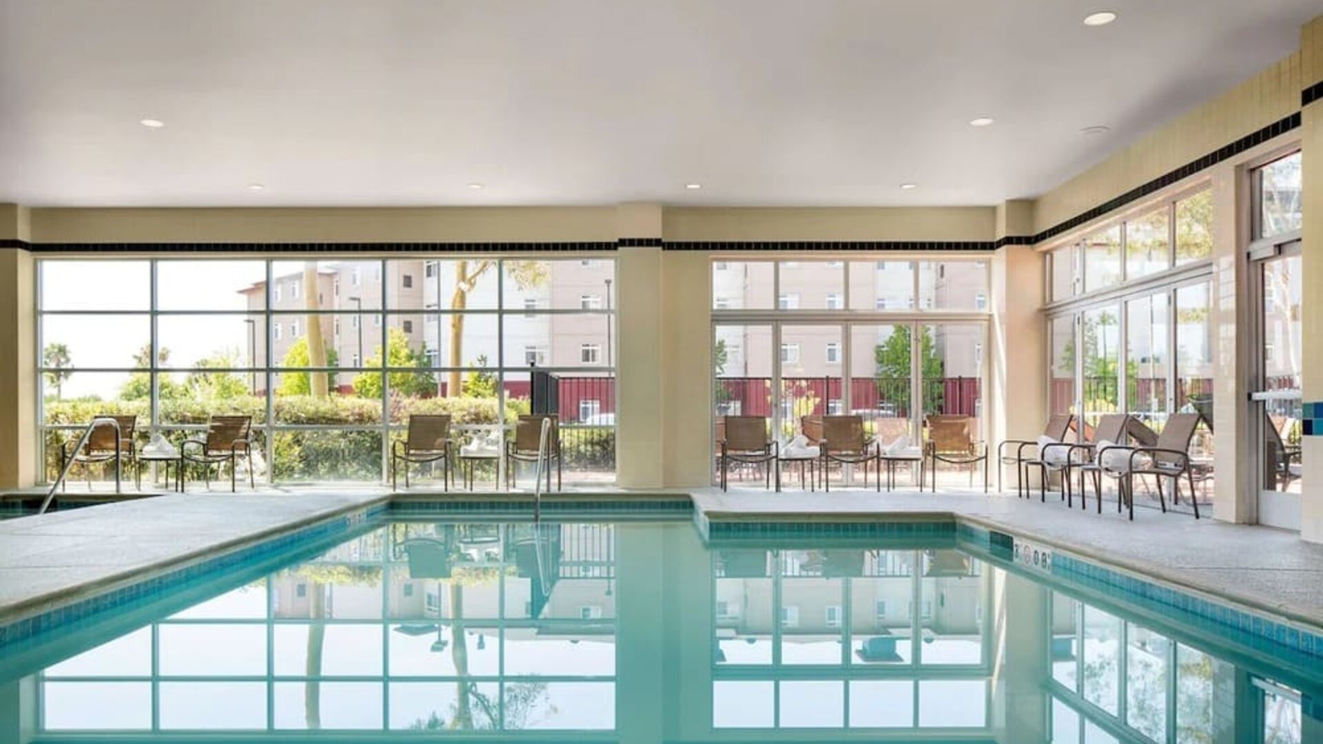 Indoor pool with lounge chairs at DoubleTree By Hilton San Francisco Airport North Bayfront.