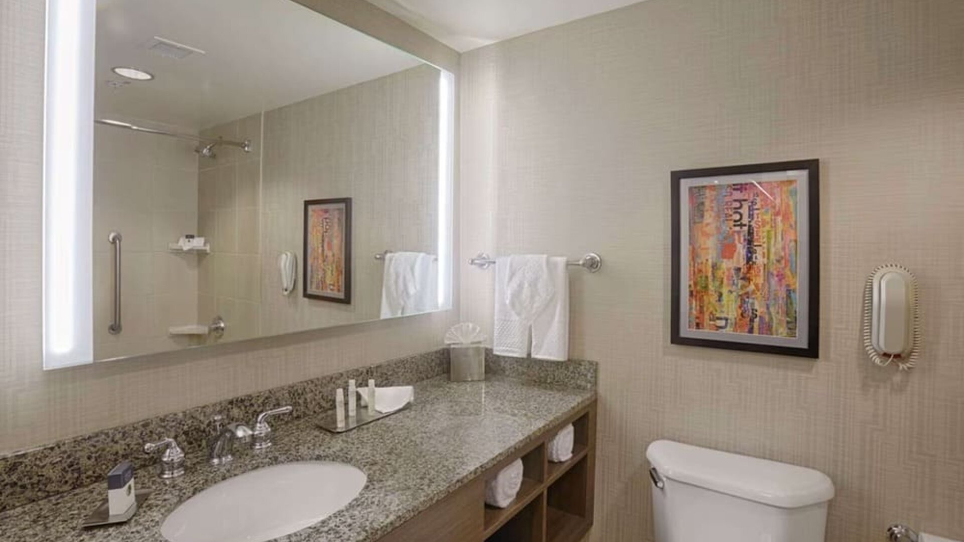 Private guest bathroom with shower and free toiletries at DoubleTree By Hilton San Francisco Airport North Bayfront.