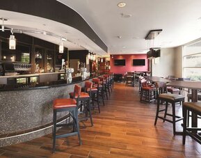 On-site bar with lounge area at DoubleTree By Hilton San Francisco Airport North Bayfront.