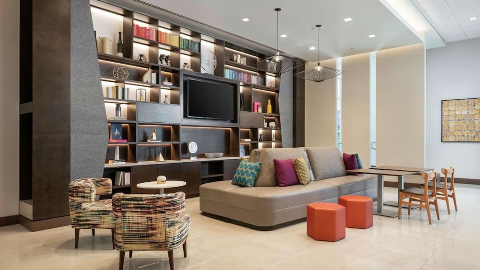 Lobby lounge area and workspace at 	Home2 Suites By Hilton Denver Downtown Convention Center.