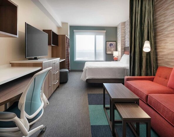 Bright and spacious day use room with workspace at 	Home2 Suites By Hilton Denver Downtown Convention Center.