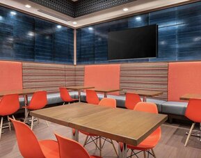 Dining area with comfortable seating at 	Home2 Suites By Hilton Denver Downtown Convention Center.