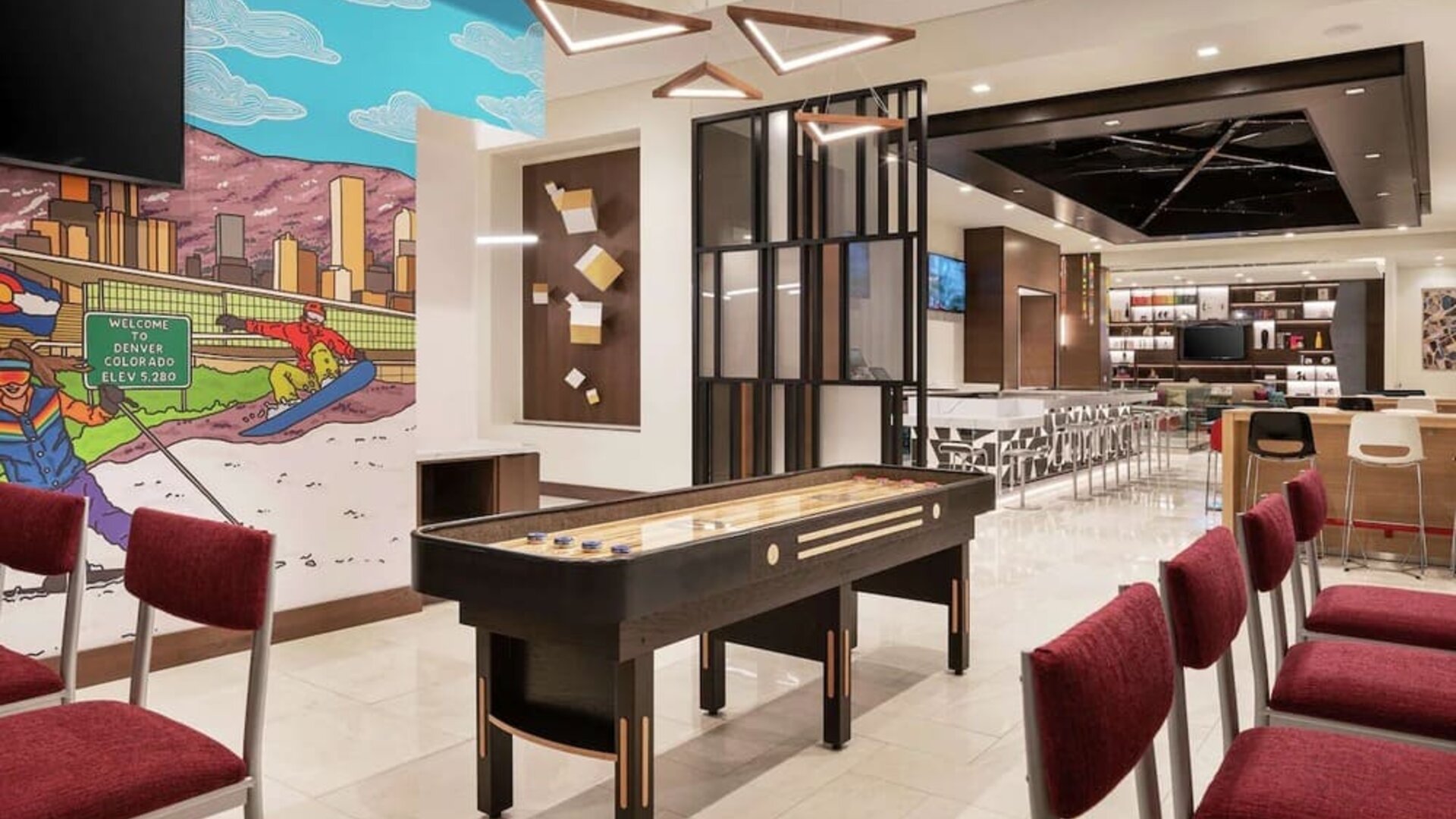 Lounge and workspace area at 	Home2 Suites By Hilton Denver Downtown Convention Center.