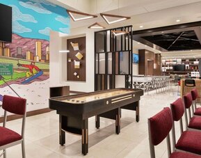 Lounge and workspace area at 	Home2 Suites By Hilton Denver Downtown Convention Center.