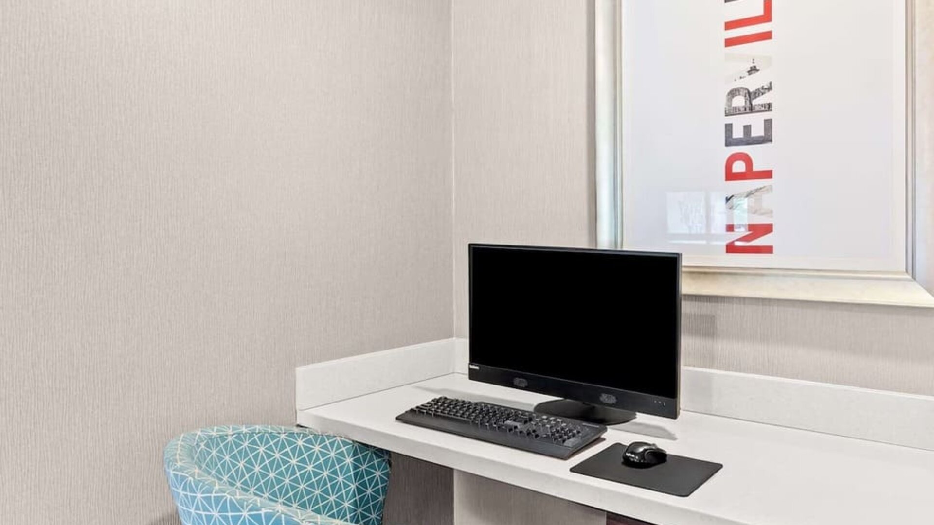 Business center with computer, printer and comfortable seating at Hampton Inn Chicago/Naperville.