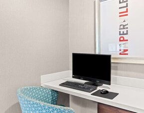 Business center with computer, printer and comfortable seating at Hampton Inn Chicago/Naperville.