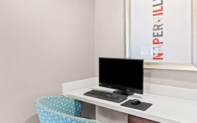 Business center with computer, printer and comfortable seating at Hampton Inn Chicago/Naperville.