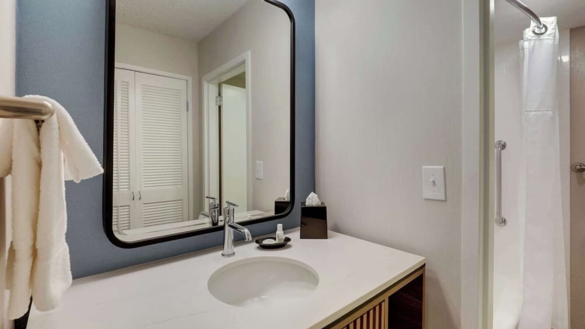 Private guest bathroom with shower and free toiletries at Sonesta Select Scottsdale At Mayo Clinic Campus.