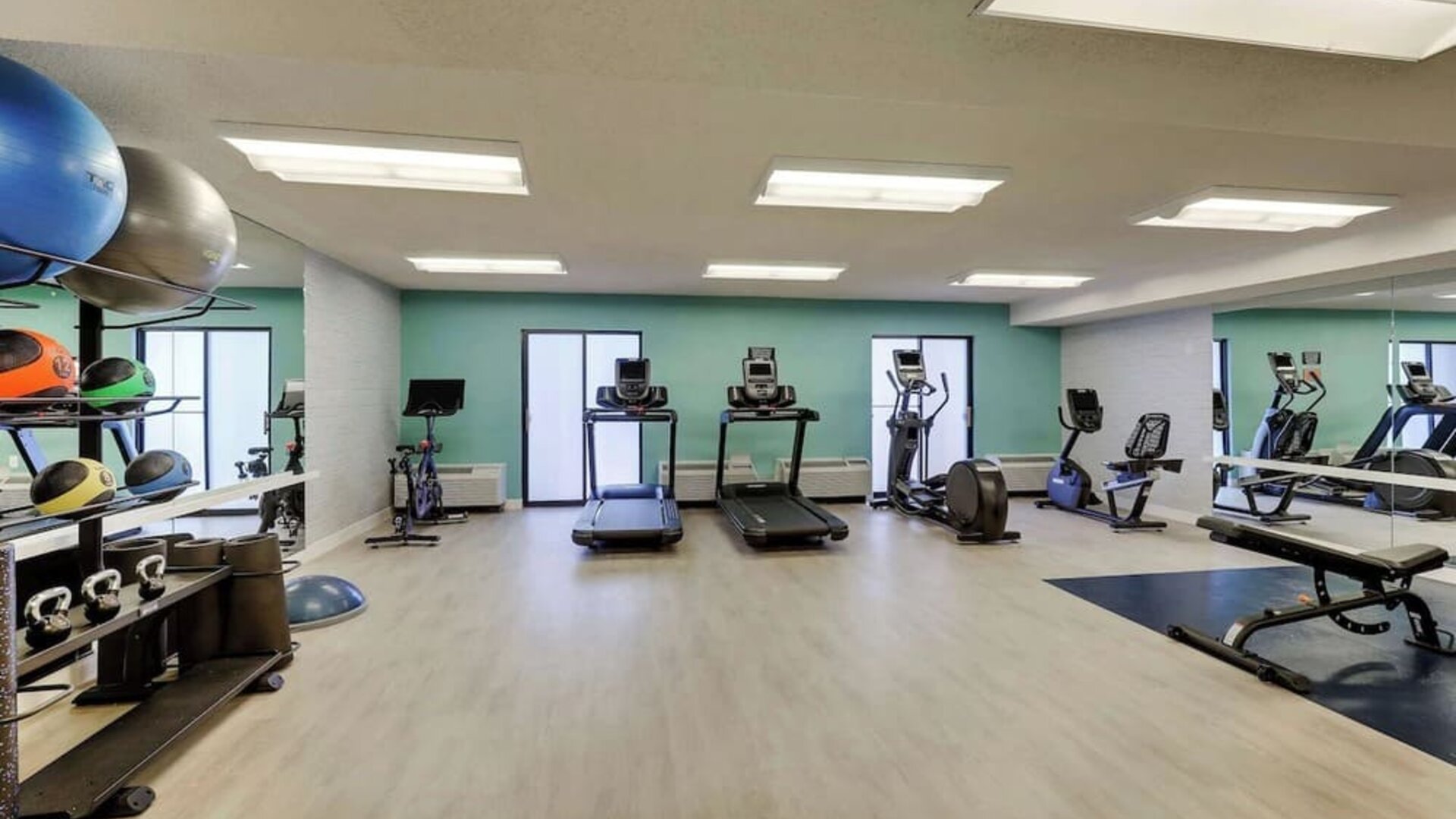 Fully equipped fitness center at Sonesta Select Scottsdale At Mayo Clinic Campus.
