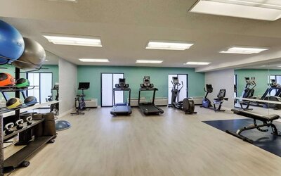 Fully equipped fitness center at Sonesta Select Scottsdale At Mayo Clinic Campus.