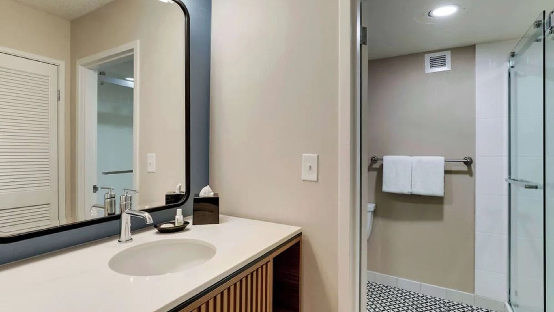 Private guest bathroom with shower and free toiletries at Sonesta Select Scottsdale At Mayo Clinic Campus.