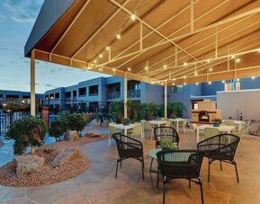 Hotel patio with comfortable seating and fireplace at Sonesta Select Scottsdale At Mayo Clinic Campus.
