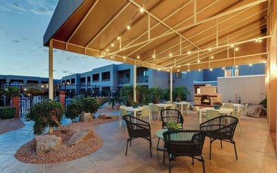 Hotel patio with comfortable seating and fireplace at Sonesta Select Scottsdale At Mayo Clinic Campus.