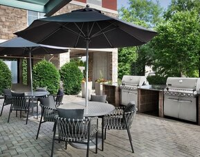 Barbecue grill and picnic area at TownePlace Suites Franklin Cool Springs.