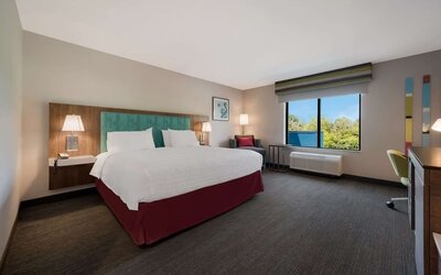 Spacious day use room with work desk at Hampton Inn Detroit Southfield.
