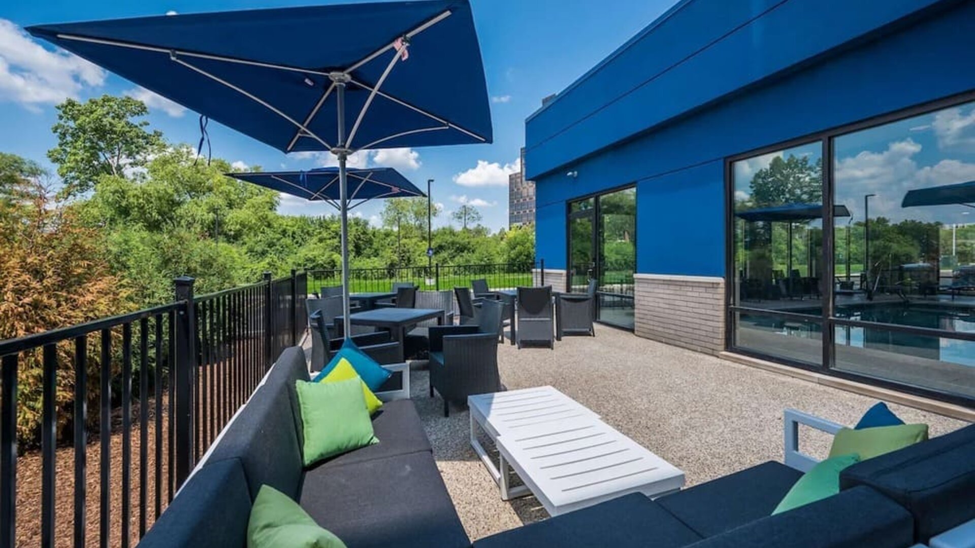 Terrace with ample seats perfect for coworking at Hampton Inn Detroit Southfield.
