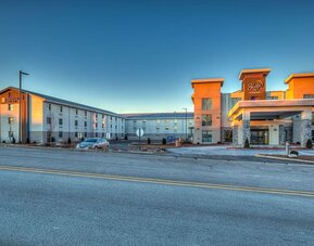 Exterior and parking area at Sleep Inn Oakbrook Terrace.