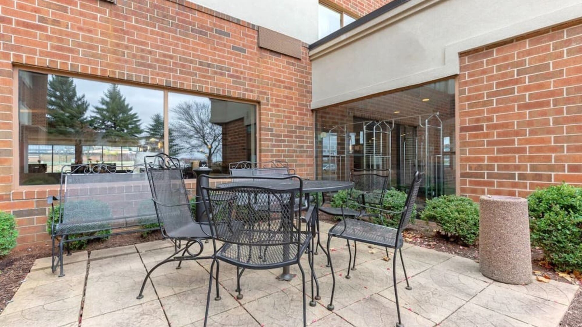Outdoor terrace with seating at Holiday Inn Express Chicago - Downers Grove.