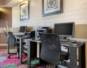 Business center with computers, printer and ergonomic chairs at Holiday Inn Express Chicago - Downers Grove.