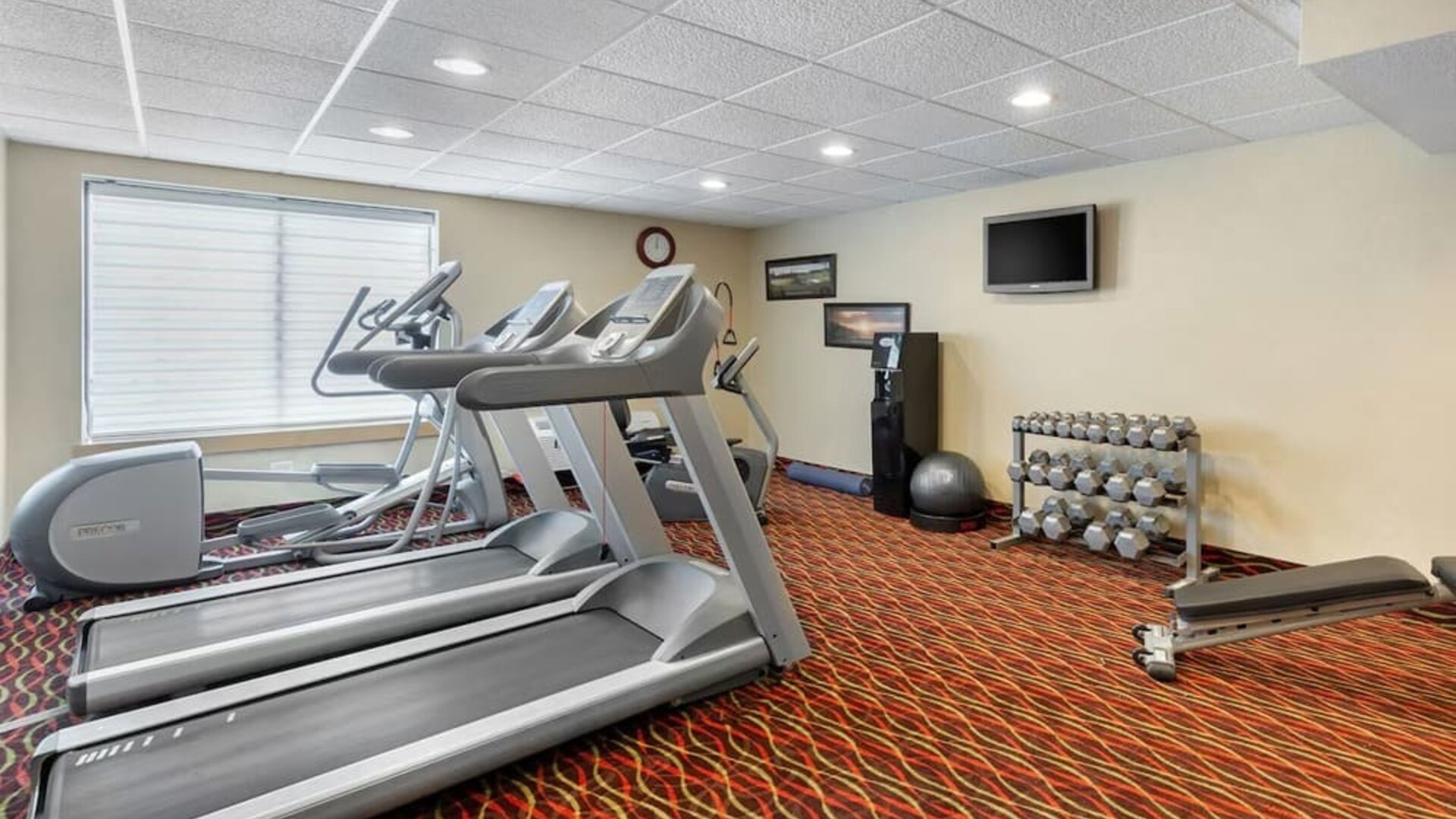 Well equipped fitness center at Holiday Inn Express Chicago - Downers Grove.