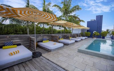 Outdoor pool with lounge beds at Catalina Hotel & Beach Club.