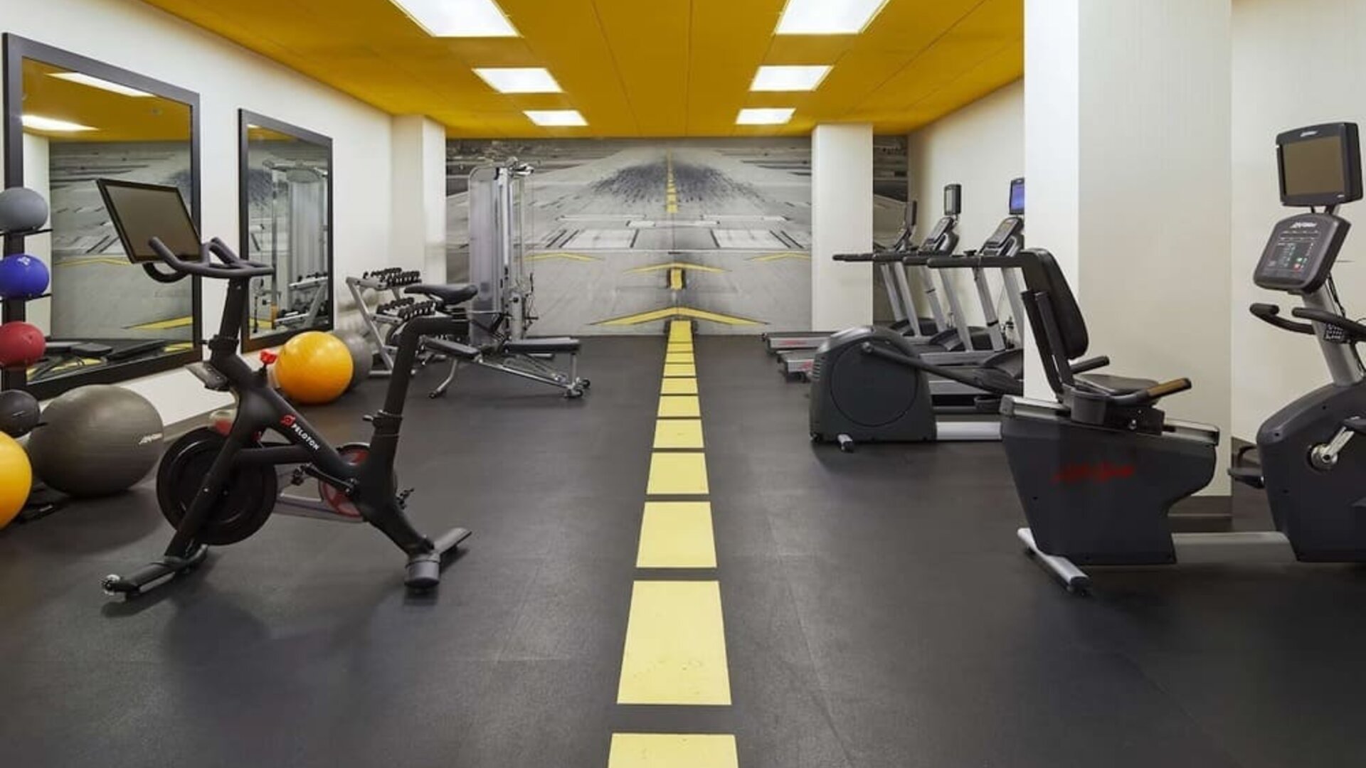 Fully equipped fitness center at H Hotel Los Angeles, Curio Collection By Hilton.