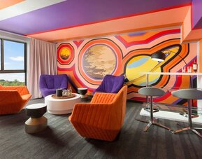 Bold design in the living room curated by talented artists at Hotel Studio Allston.