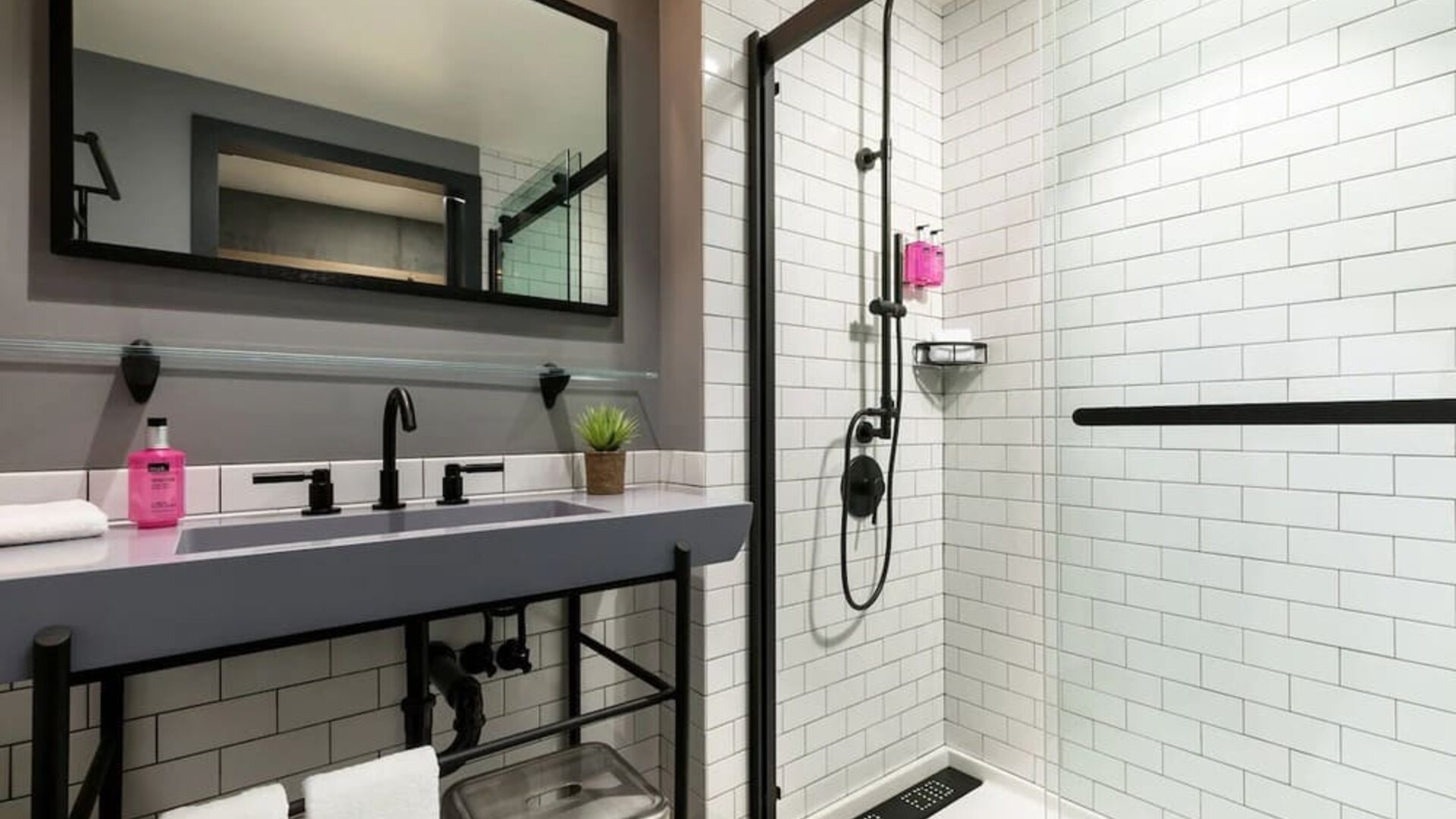 Private guest bathroom with shower at Moxy Boston Downtown.