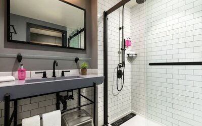 Private guest bathroom with shower at Moxy Boston Downtown.
