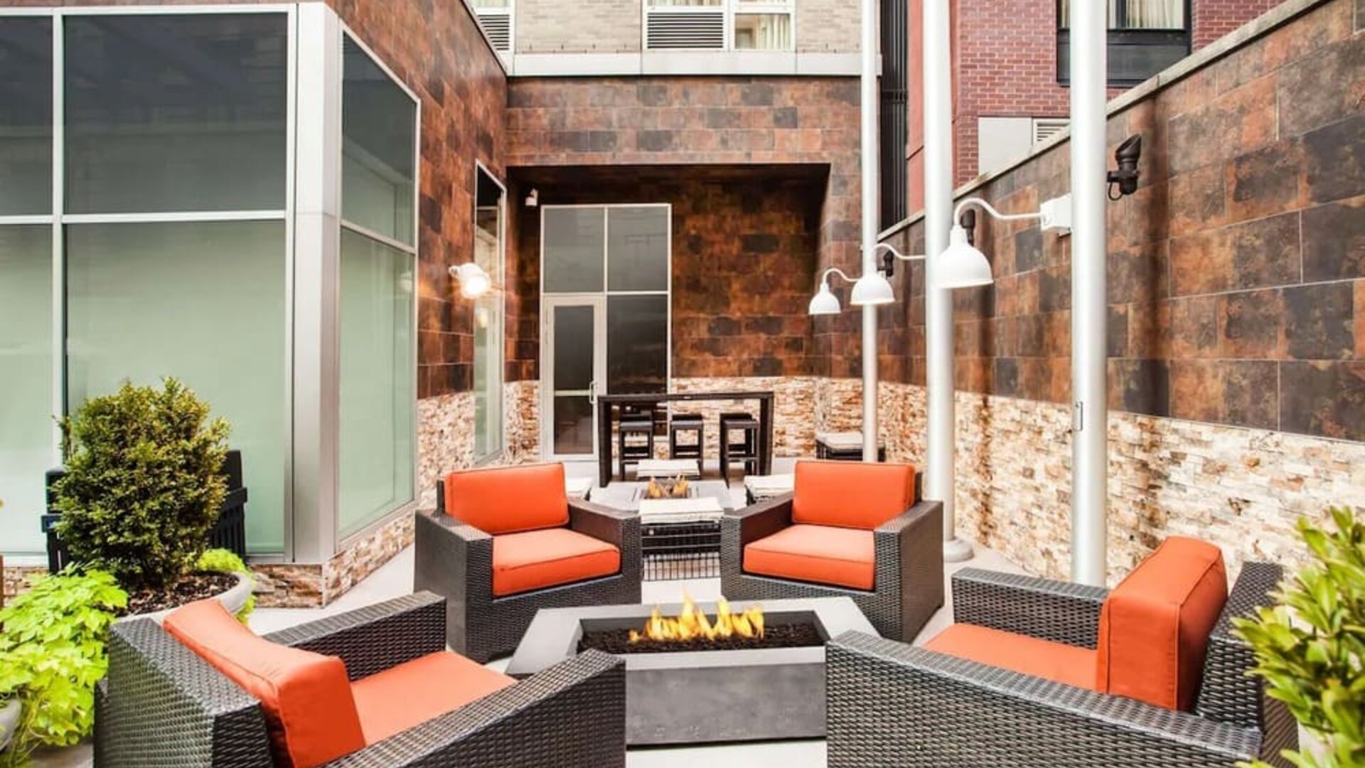 Cozy coworking space with fire pit at Hilton Garden Inn New York/West 35th Street.
