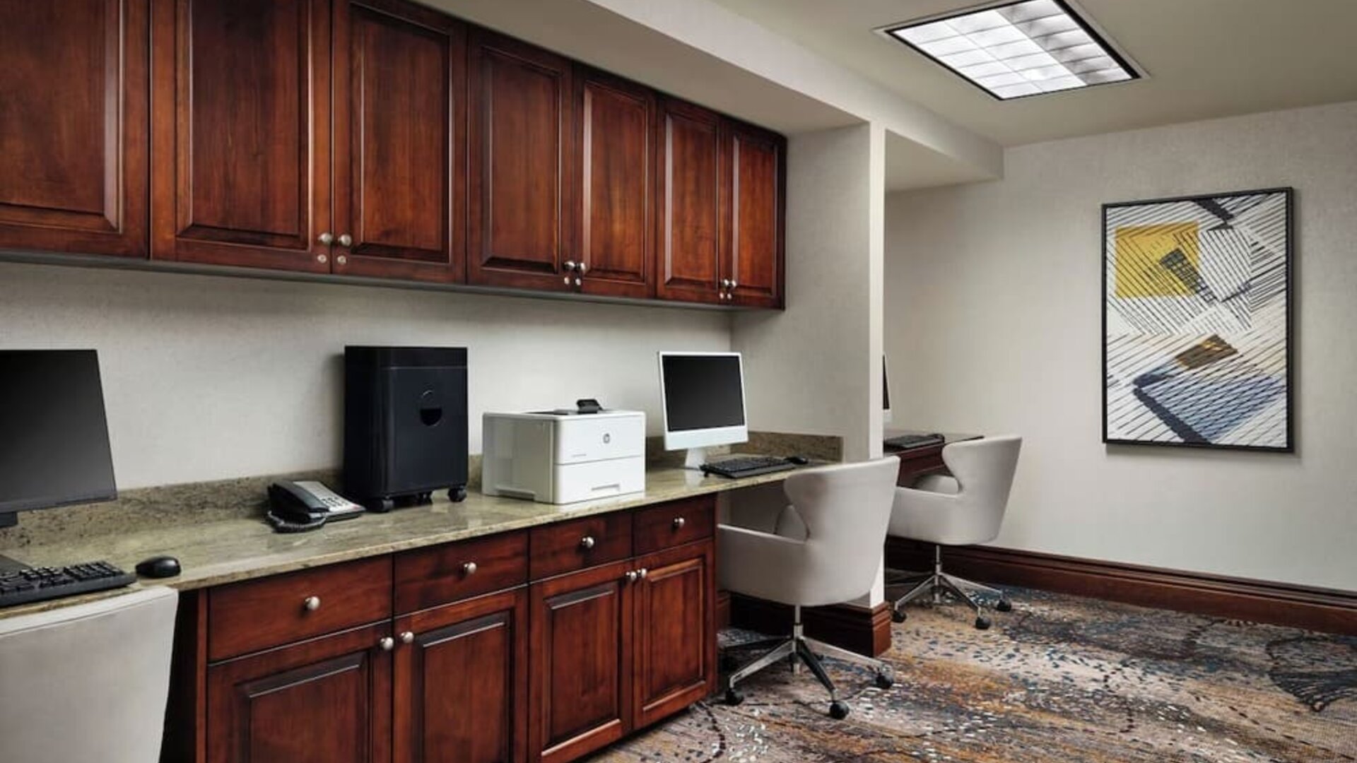 Business center with computers, printer and ergonomic chairs at Homewood Suites By Hilton Shreveport / Bossier City, LA.