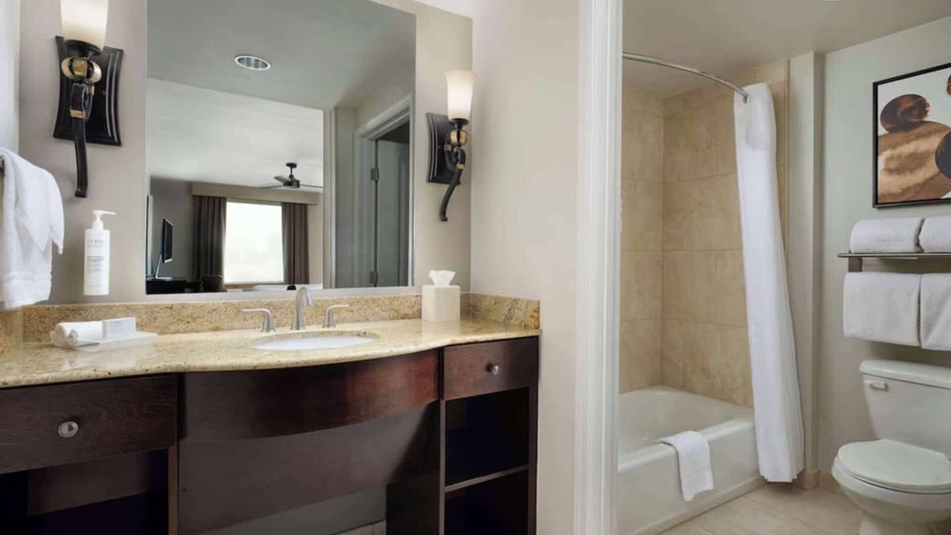 Private guest bathroom with combined shower and tub at Homewood Suites By Hilton Shreveport / Bossier City, LA.