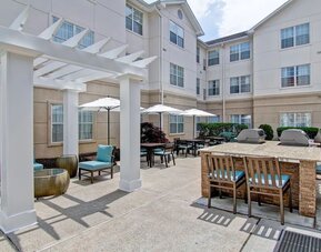Terrace' seating area at Homewood Suites By Hilton Newark-Cranford.