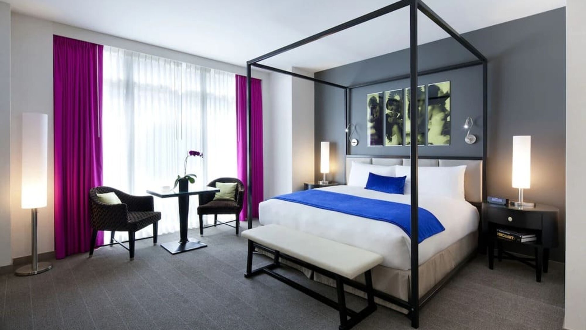King bedroom with seating area and natural light at Royalton Park Avenue.