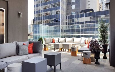 Terrace with ample seats perfect for coworking at The Bernic Hotel New York City, Tapestry Collection By Hilton.