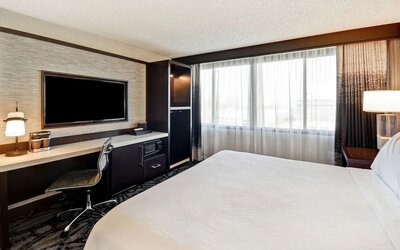 Day use room with work desk and natural light at Embassy Suites By Hilton Santa Clara Silicon Valley.