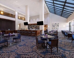 Spacious hotel bar perfect for coworking at Embassy Suites By Hilton Santa Clara Silicon Valley.