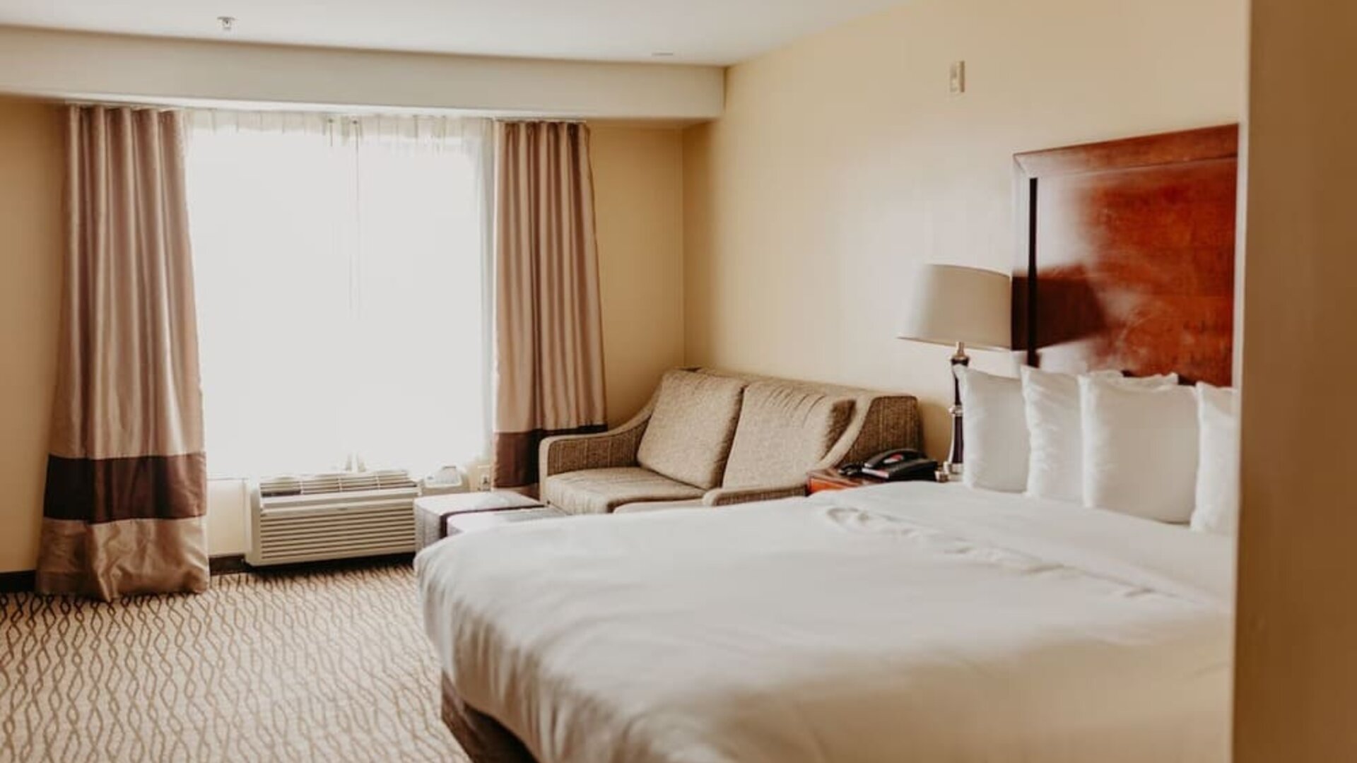 Delux king room with natural light at Comfort Inn Pomona Near Fairplex.