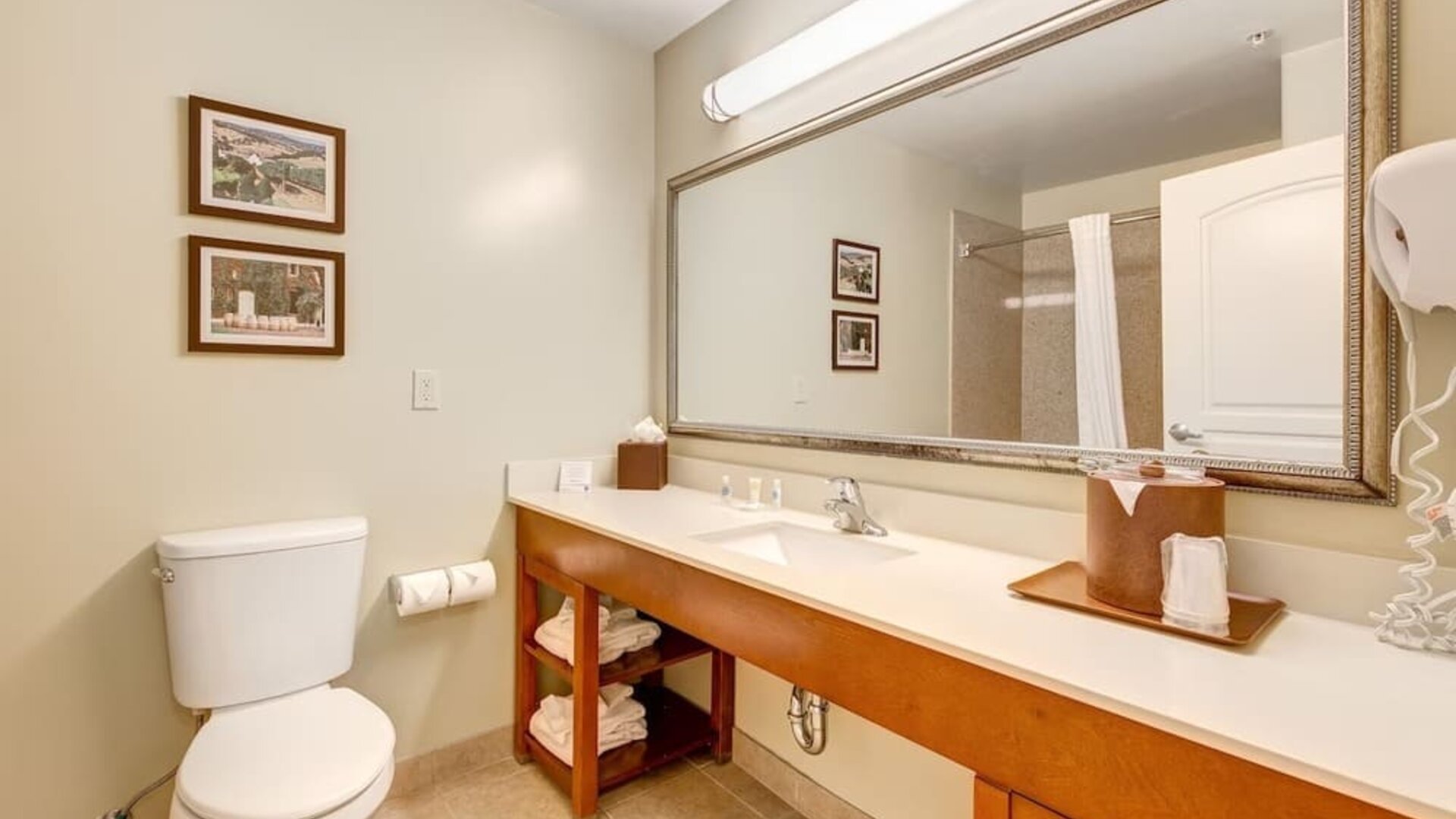 Private guest bathroom with shower at Comfort Inn Pomona Near Fairplex.