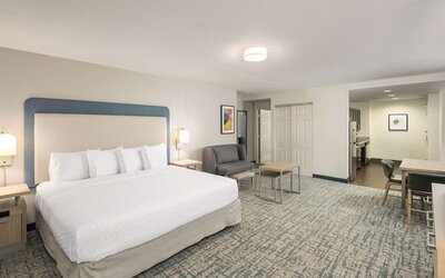 Spacious day use room with sofa and work desk at Homewood Suites By Hilton Miami Airport-Blue Lagoon.